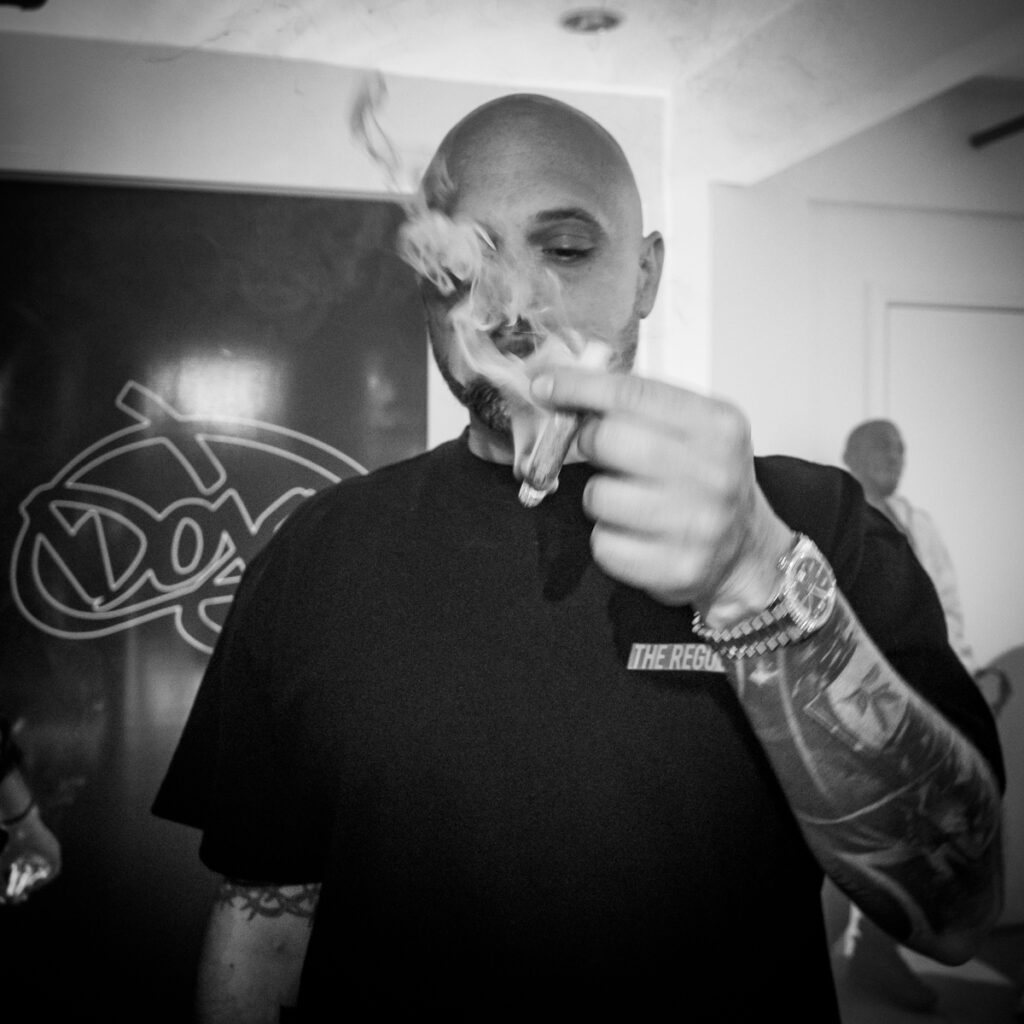Ryan aka Doja Pak smokes a joint at the weekly Hollywood Strain Premier event in Hollywood, July 28, 2022.